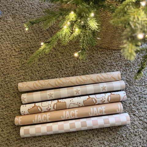 Name-printed gifts under a Christmas tree