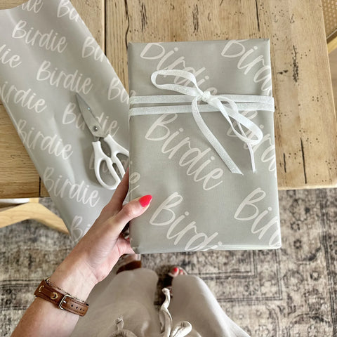 Gifts wrapped in personalized Paperbloom paper